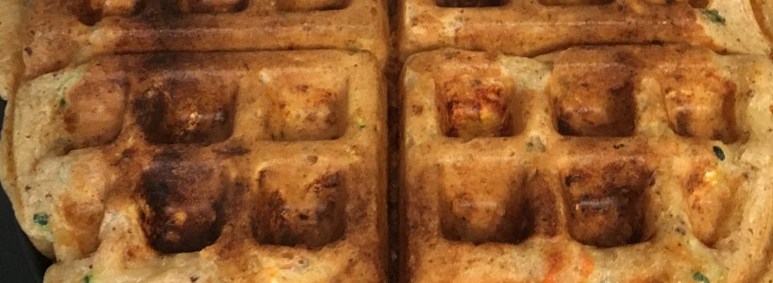 Homemade veggie Belgian waffles with a soft texture, made with vegetables and served on a plate