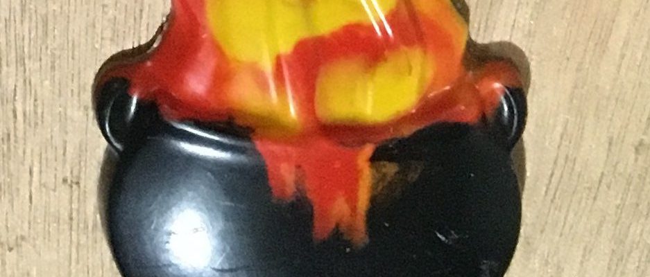 Colorful molded crayons in different shapes made from melted crayons, displayed on a table
